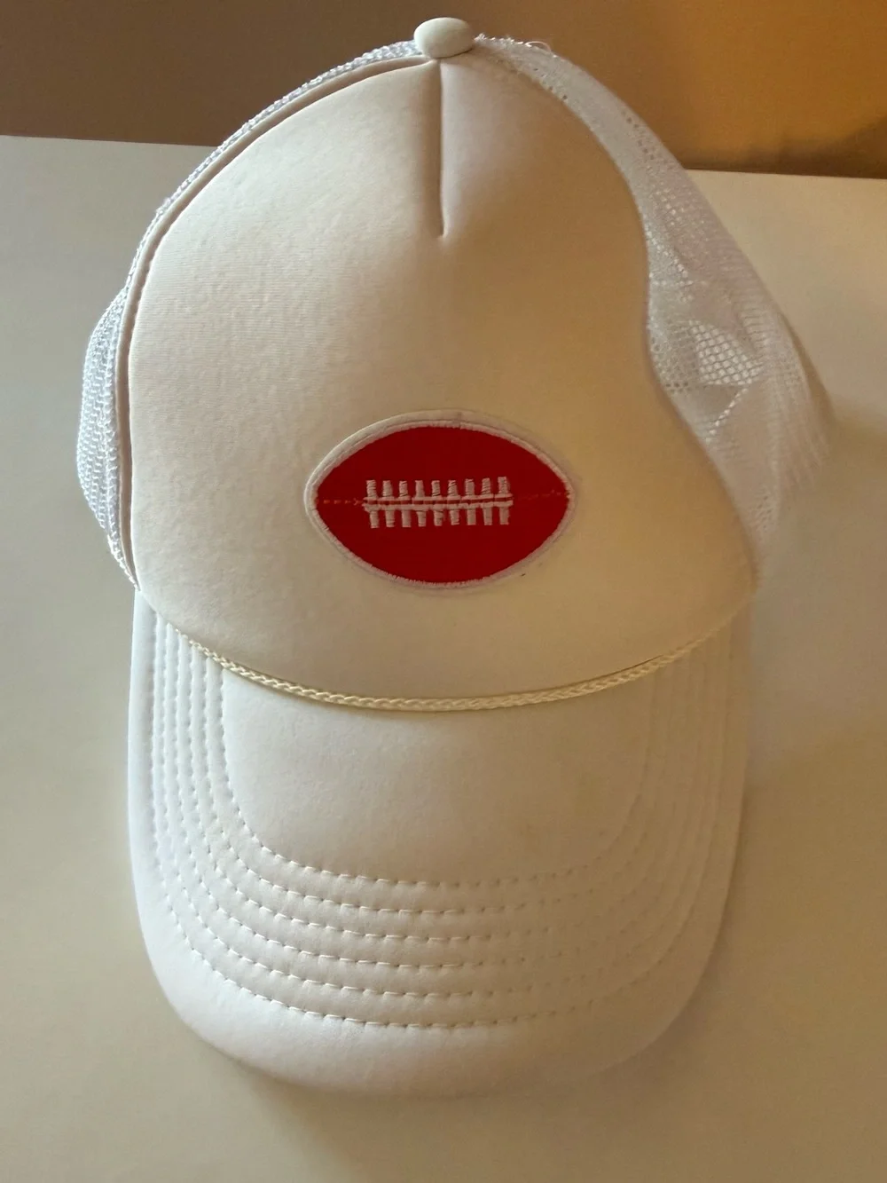 Trucker hat with crimson football